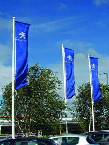 Swivel arm flags on a dealership forecourt